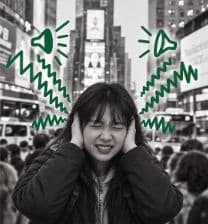 Lucy covering her ears, with illustrated noise symbols around her